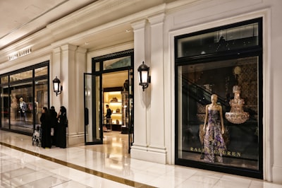 woman in black and white dress standing near door